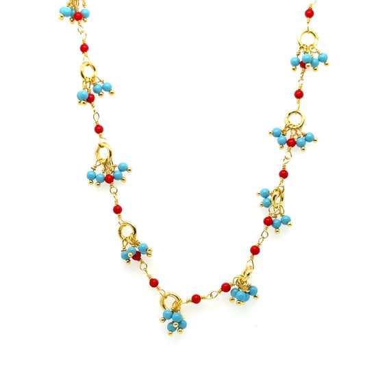 Gold necklace with bright Turquoise and red Coral gemstone beads arranged in clusters