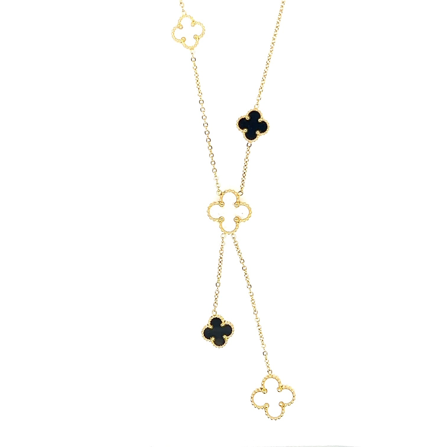 Lariat necklace with five small and medium sized reversible clover charms in black and white