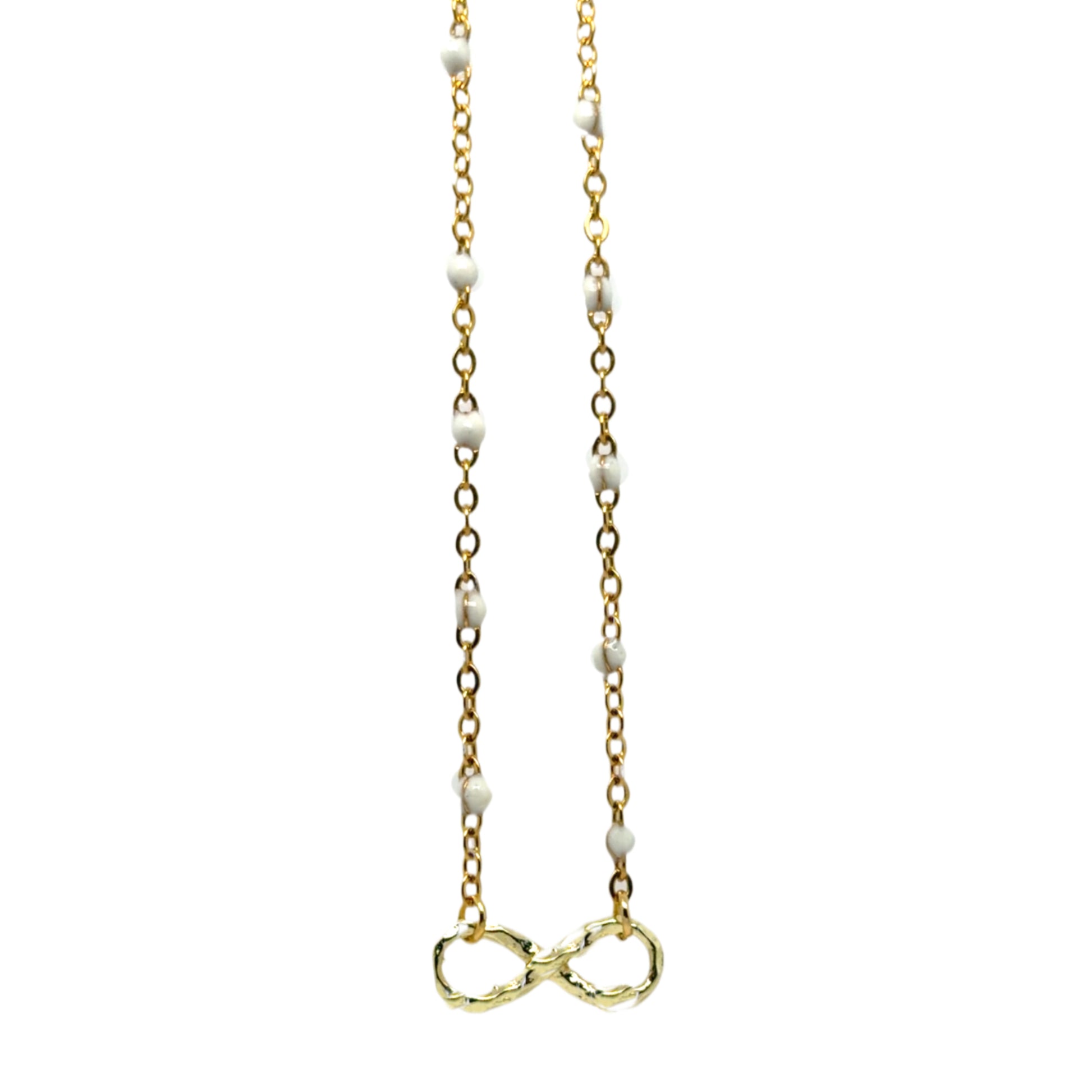 Gold necklace with white beads and an infinity symbol on a white background