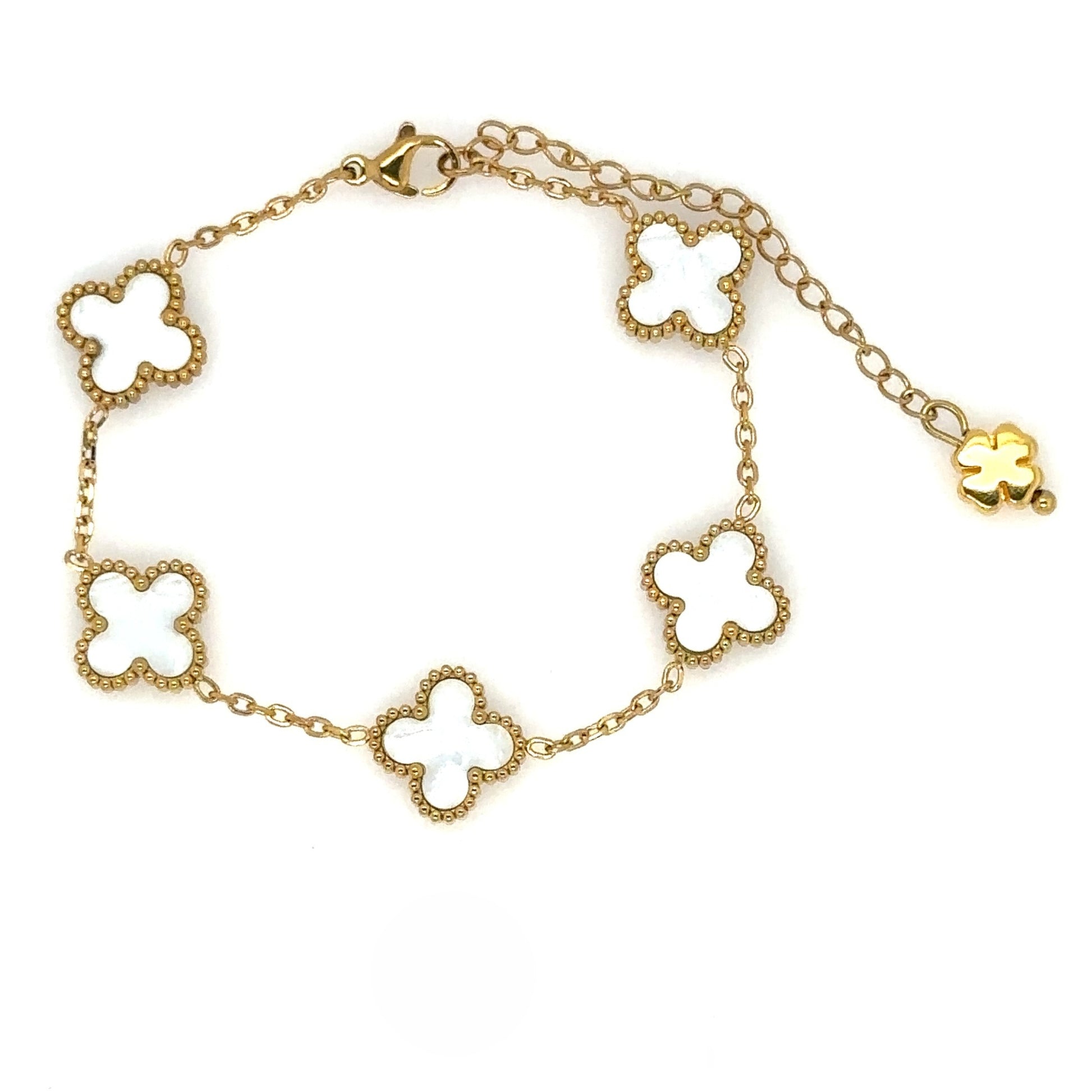 gold bracelet has five small clover charms in white mother of pearl style