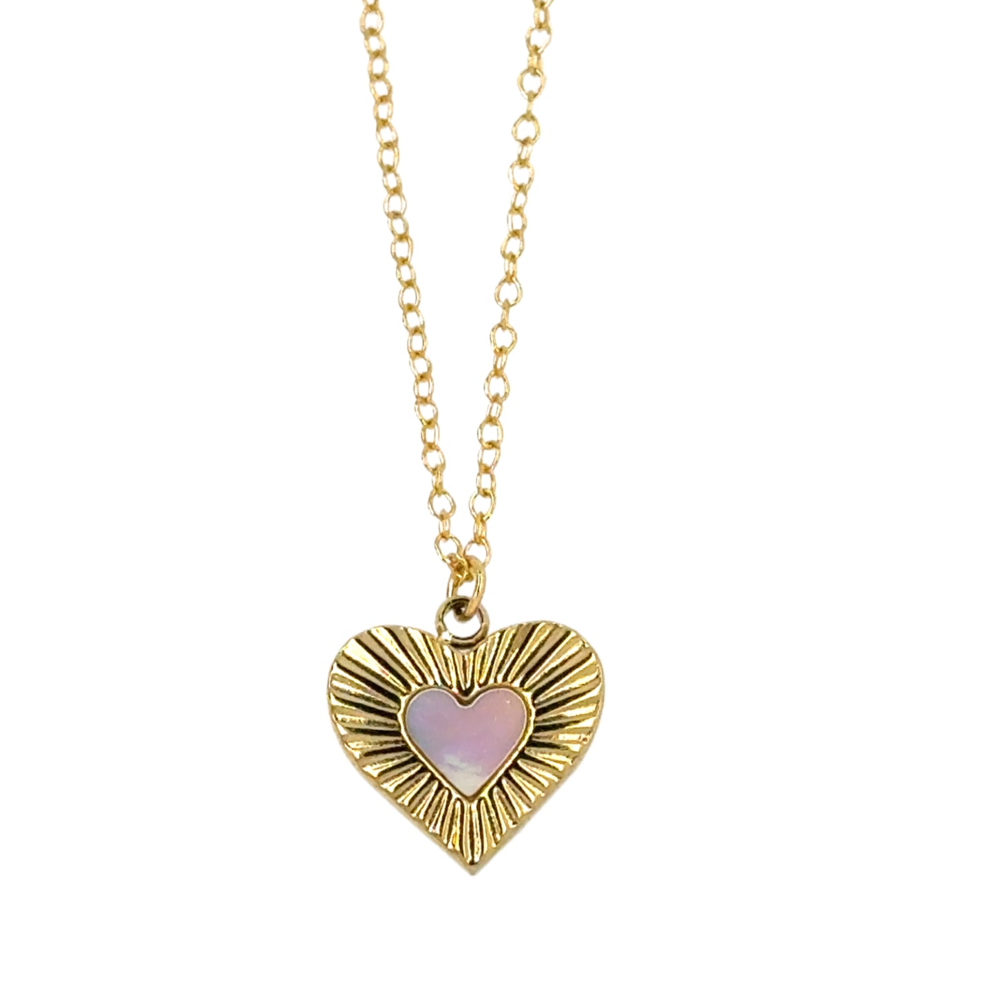 Delicate chain necklace with gold and mother of pearl heart shaped charm.