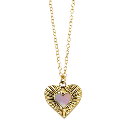 Delicate chain necklace with gold and mother of pearl heart shaped charm.