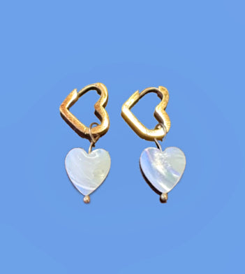 Heart shaped gold hoop earrings with heart shaped mother of pearl charms