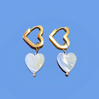 Heart shaped gold hoop earrings with heart shaped mother of pearl charms