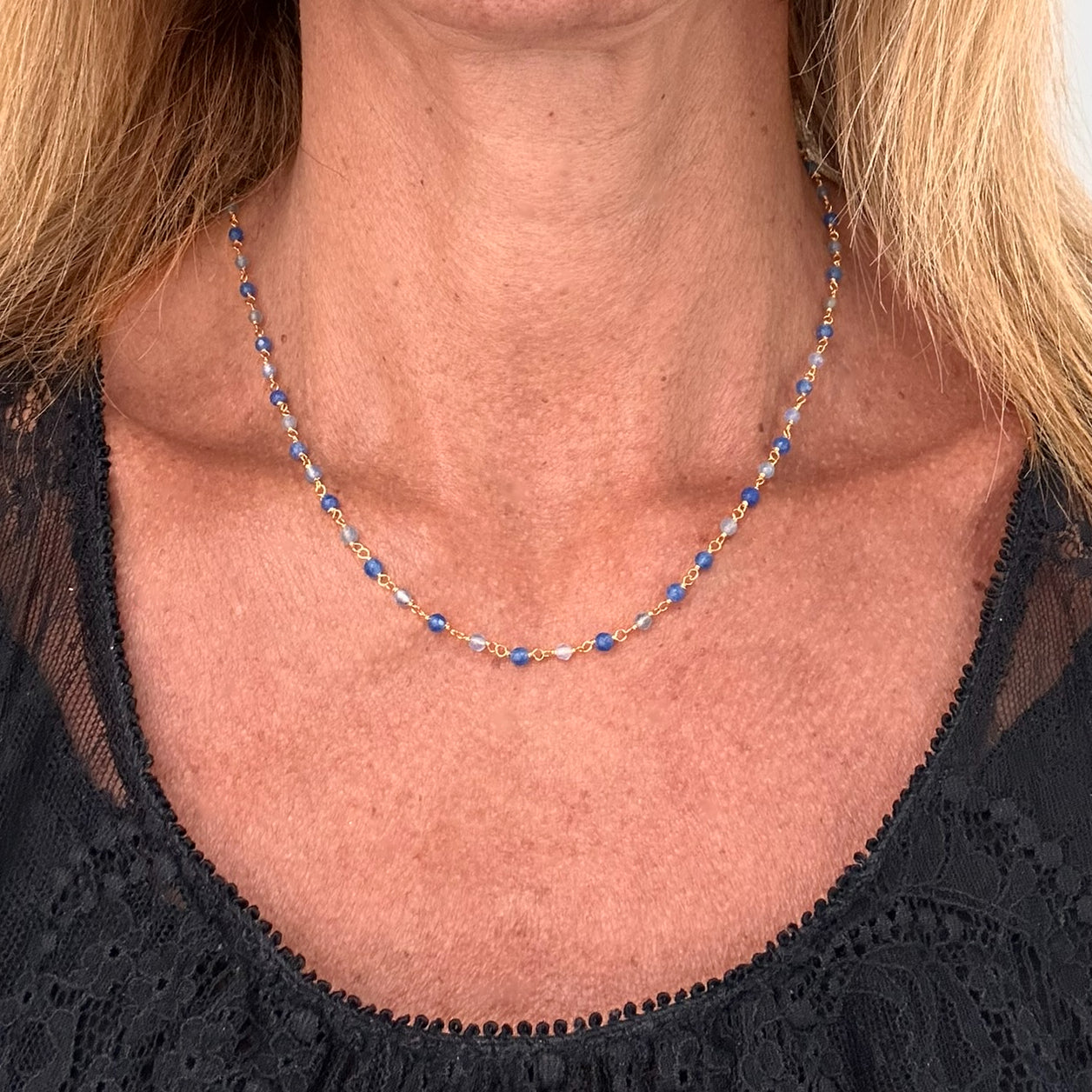 ry chain with alternating royal blue and light blue Onyx gemstones on model