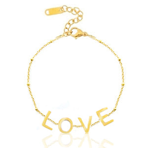gold bracelet with LOVE letters written on it