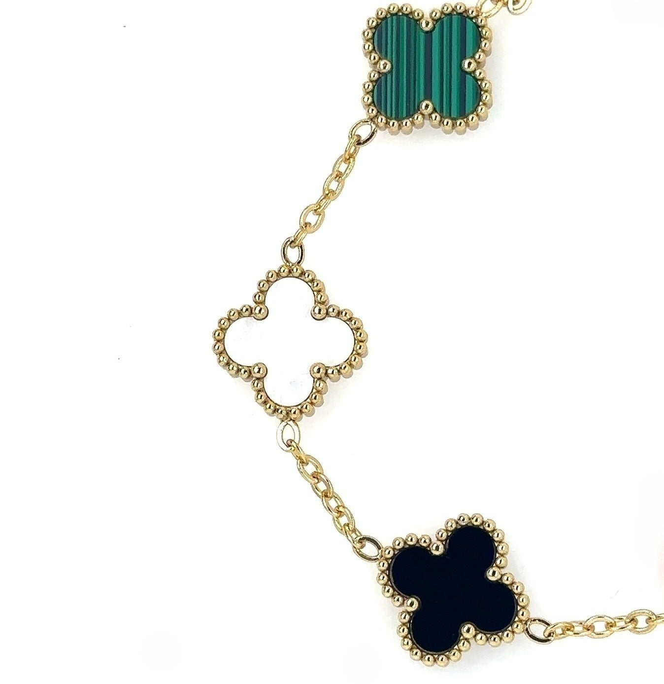 This lovely gold bracelet has five small clover charms in a rainbow of colours showing the green, white and black clovers