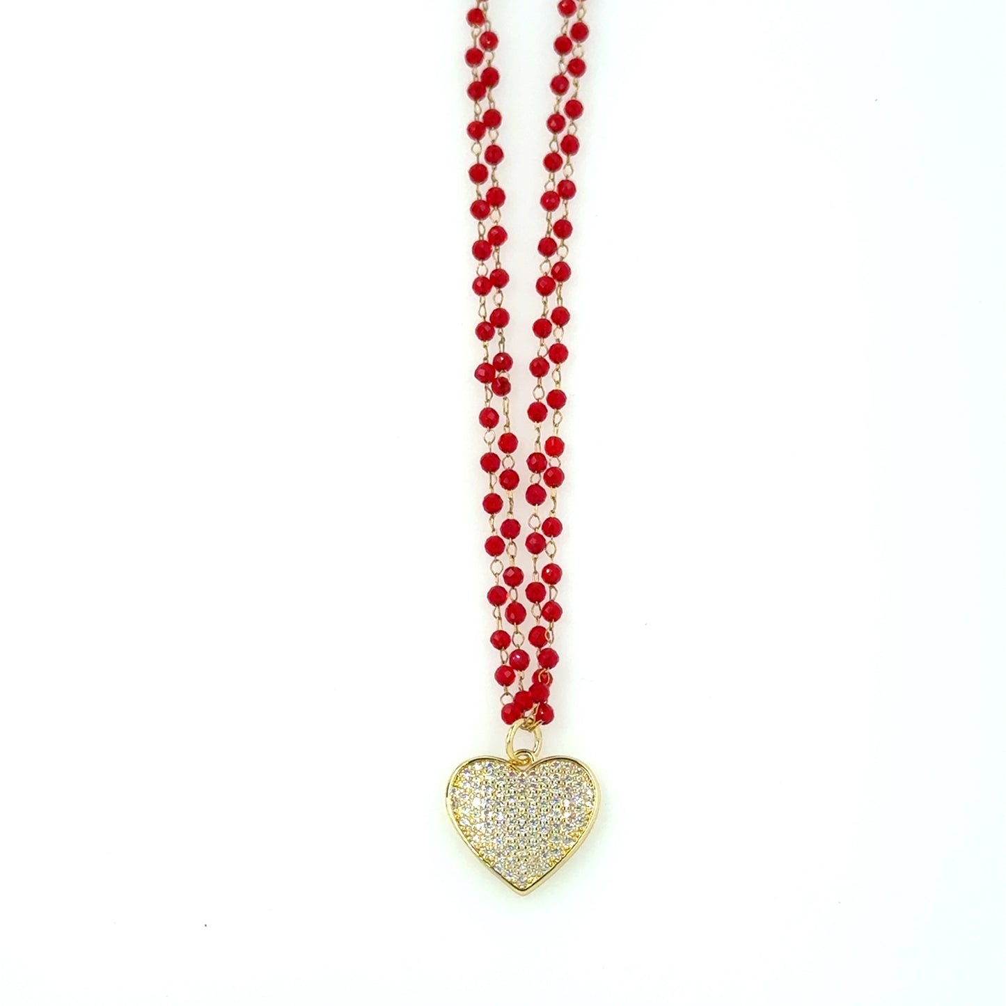 Necklace with two rows of tiny red glass beads and gold sparkly heart charm in the middle with longer chain