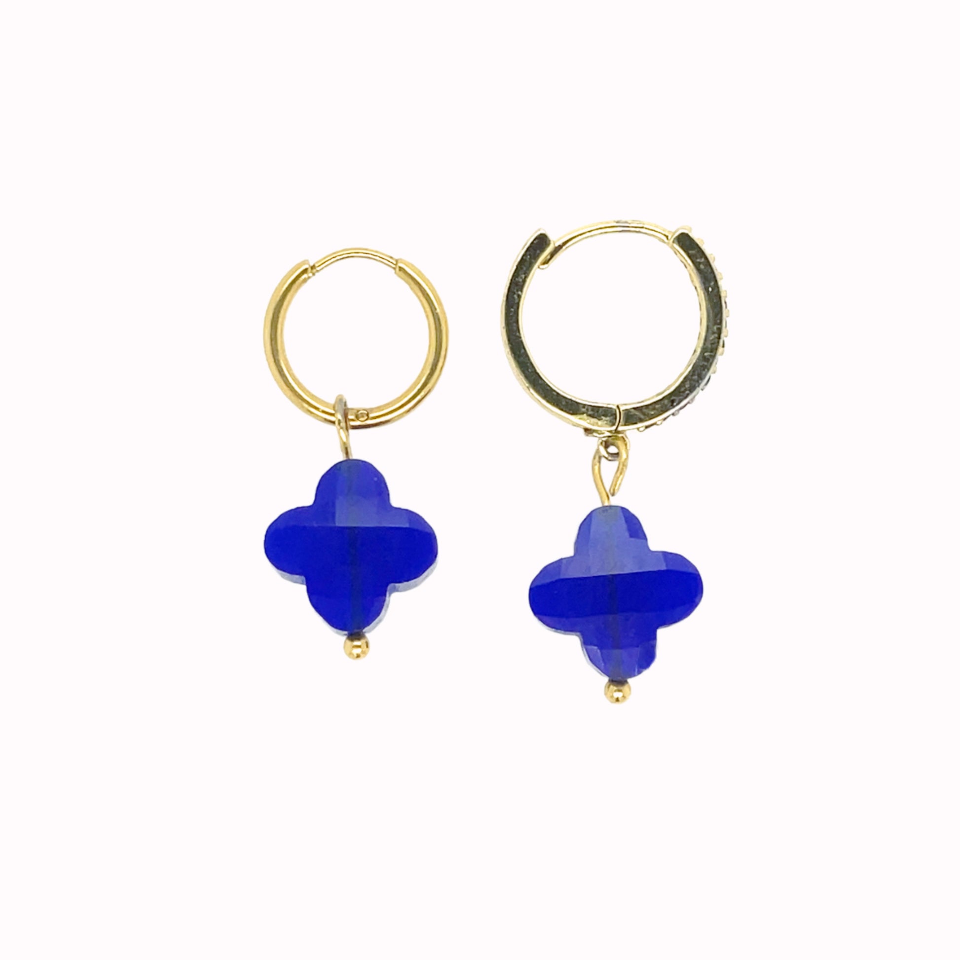 Gold hoop earrings with clover-shaped glass charm in cobalt blue