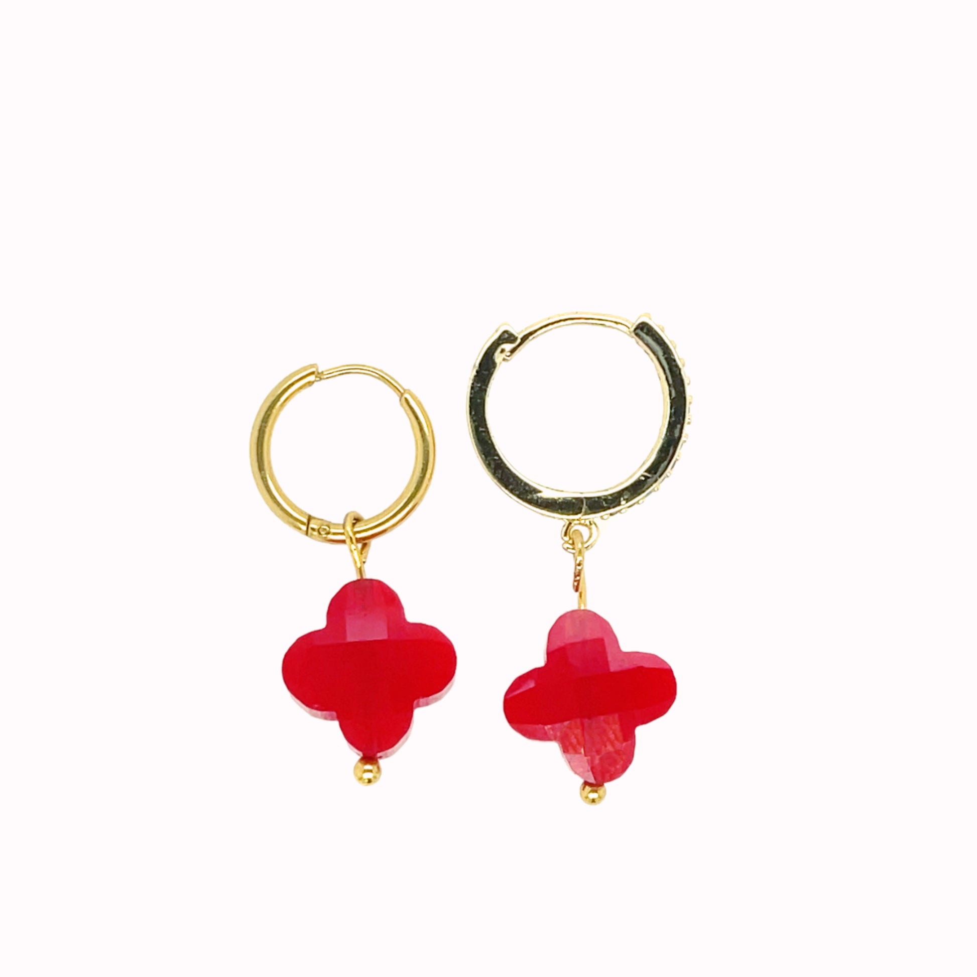 Gold hoop earrings with clover-shaped glass charms in siam red