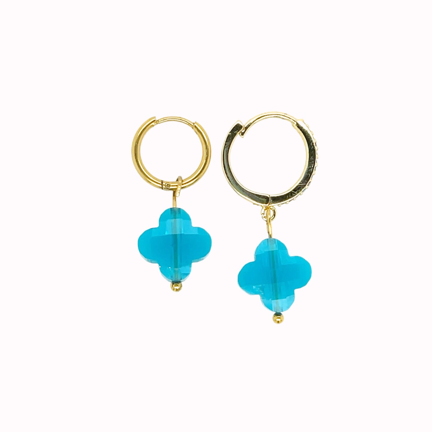 Gold hoop earrings with rainbow clover-shaped glass charms in turquoise blue