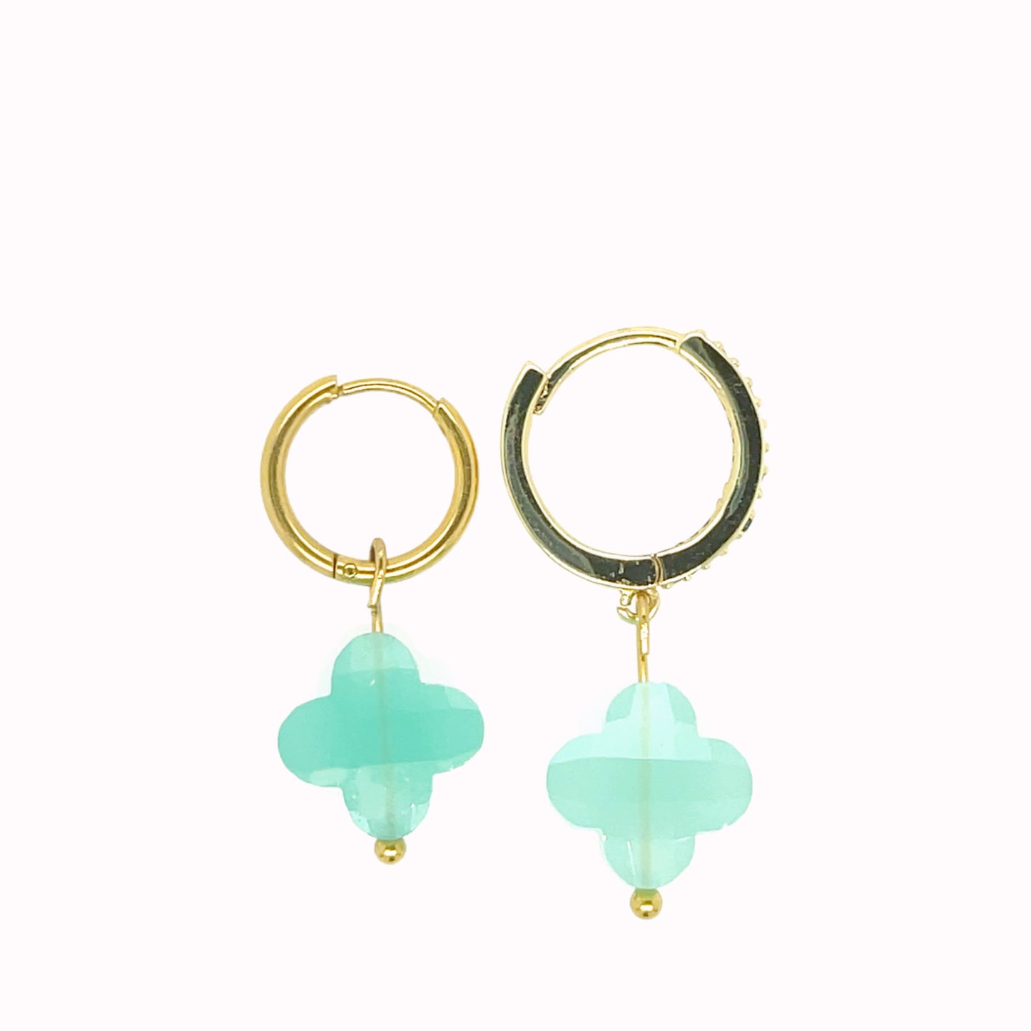 Gold hoop earrings with rainbow clover-shaped glass charms in pastel green