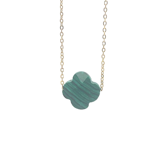 Delicate gold chain necklace with one clover charm in malachite green